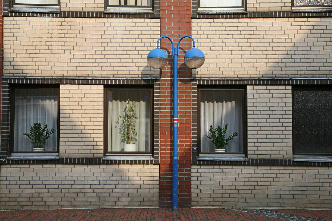 blue street lights, brick facade, northern Germany
