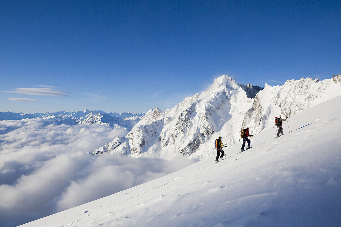 Three back-country skiers, Val Ferret, Canton of Valais, Switzerland