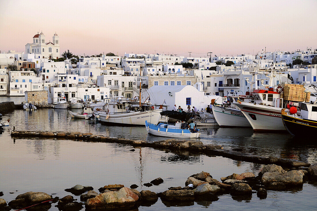 Boats at harbour in the afterglow, Naoussa, island of Paros, the Cyclades, Greece, Europe