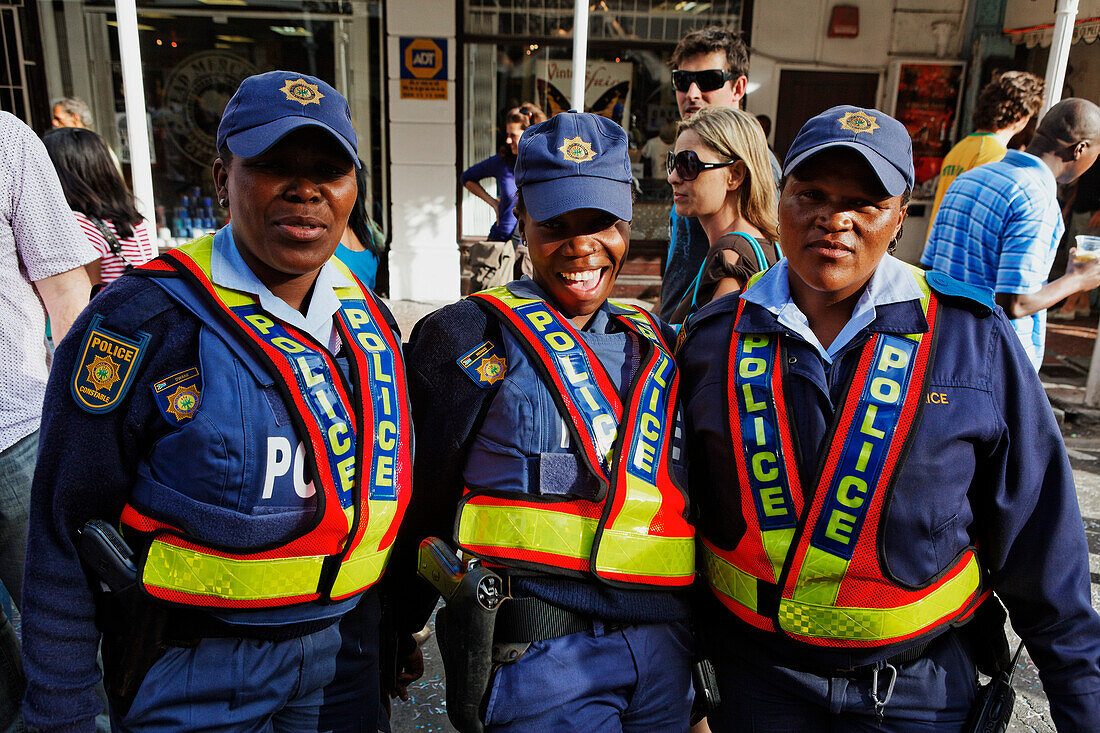 Three police women in uniform, Football world cup final draw, 04.12.2009, fans celebrate the drawing of the first round, Long street, Capetown, Western Cape, South Africa, Africa
