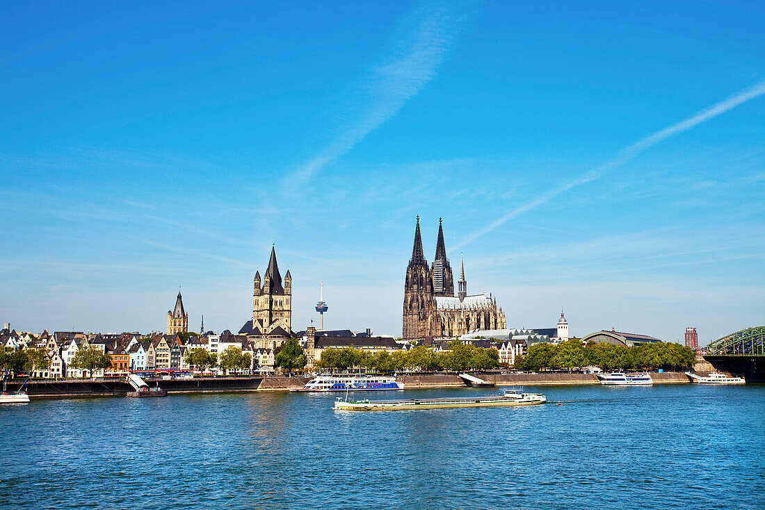 View over rive Rhine to old town with cathedral and Great St. Martin church, Cologne, North Rhine-Westphalia, Germany
