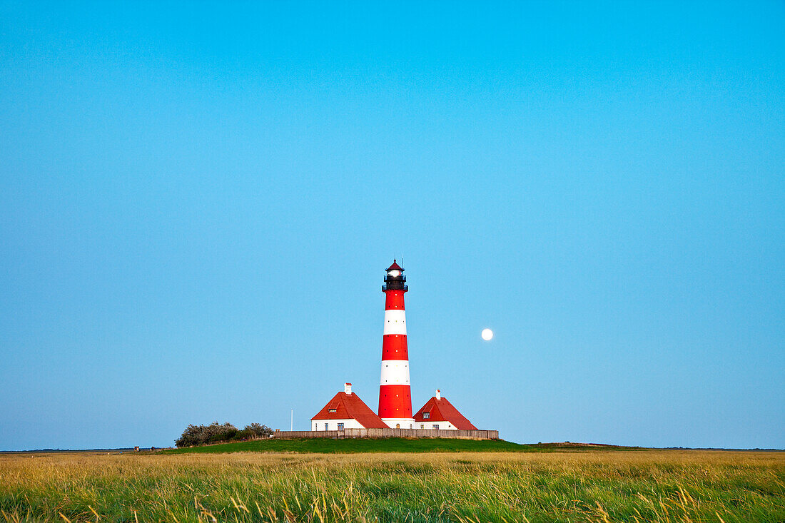 Westerheversand Lighthouse with full moon, Westerhever, Schleswig-Holstein, Germany