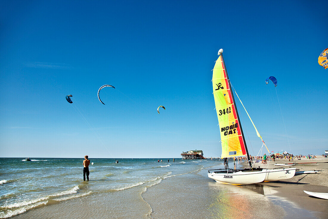 Kitesurfing near beach, Sankt Peter-Ording, Schleswig-Holstein, Germany