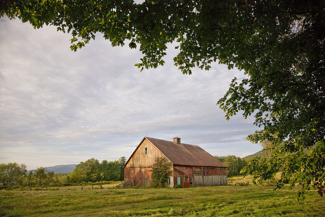 An old red barn in rural New Hampshire along Route 2