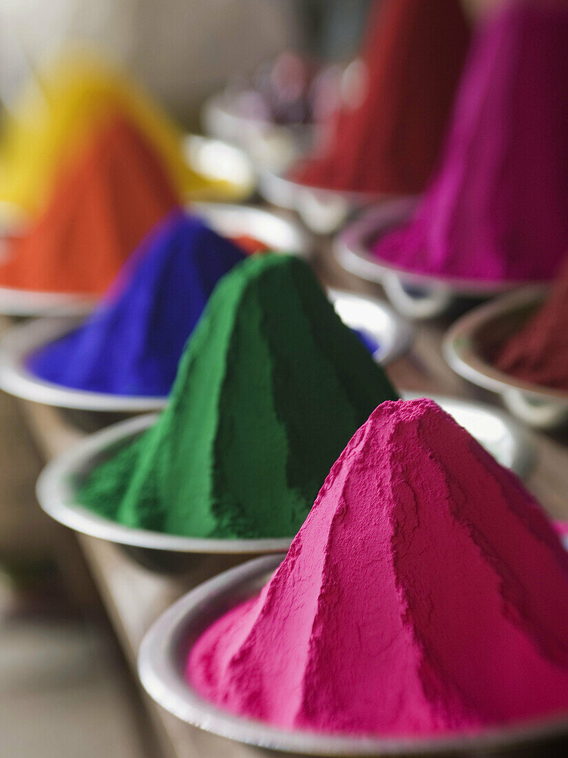 Colored powder used in rituals for sale in the main market in Mysore,  Karnataka,  India (intentional selective focus)