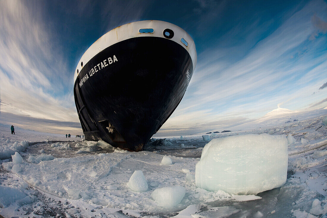 Marina Svetaeva,  Ice_strengthened Russian cruise ship ( Aurora Expeditions) in McMurdo Sound _ volcano Mt Erebus behind