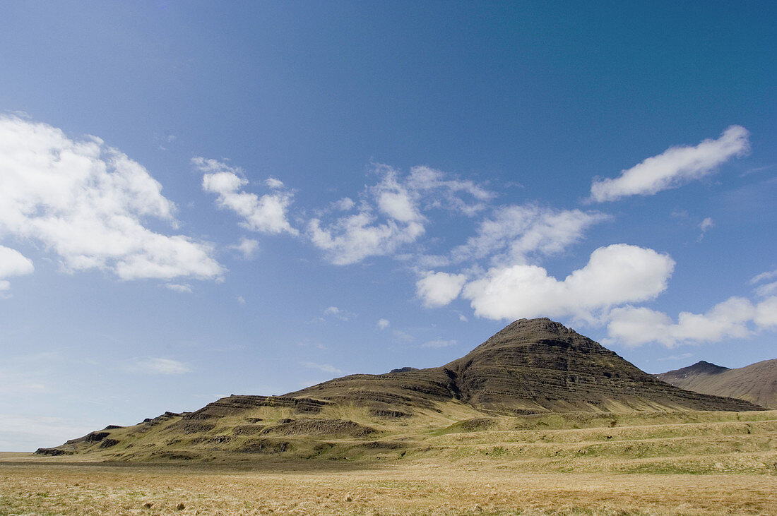 volcanic mountain range with blue sky