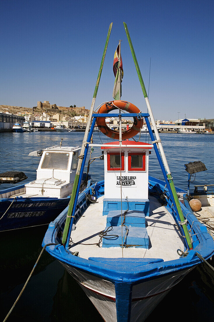 Fishing boats at port and ´alcazaba´ in background,  Almeria. Andalucia,  Spain