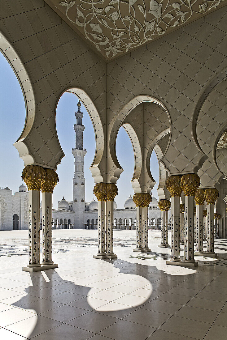 Collonade details and minaret of the Sheikh Zayed bin Sultan Al Nahjan Mosque,  Grand Mosque,  Abu Dhabi,  United Arab Emirates,  Asia