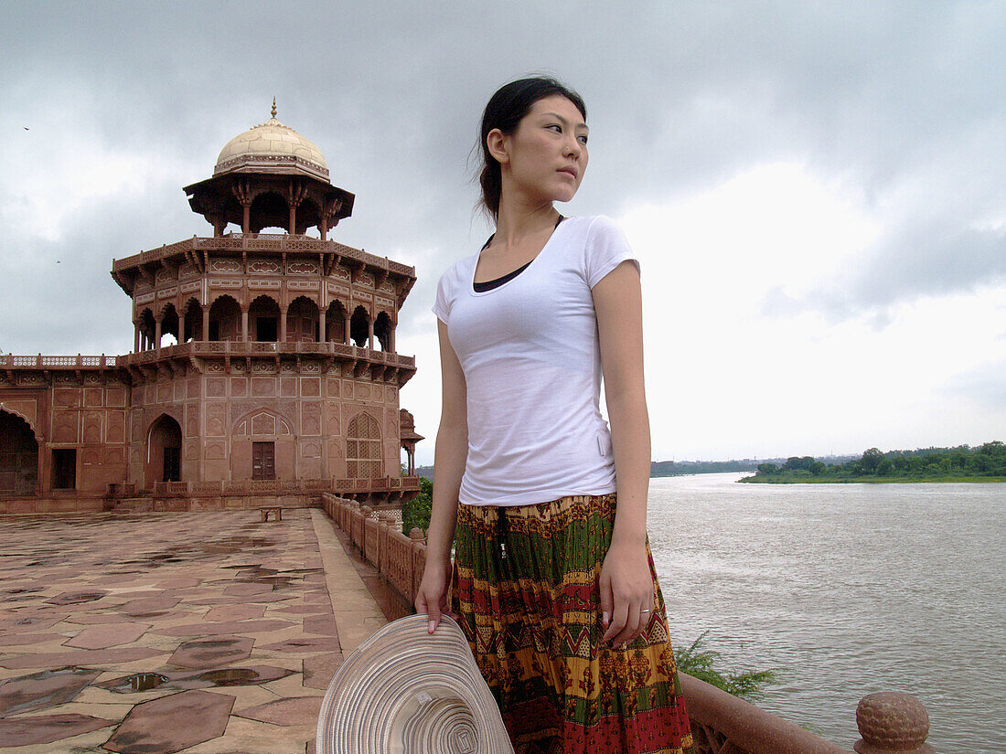 Asian chinese woman in the Taj Mahal complex in Agra India