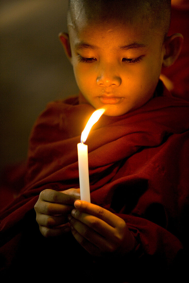 Buddhist Monks light candels for Buddhas Birthday ceremony,  Mahagandhayon Monastery