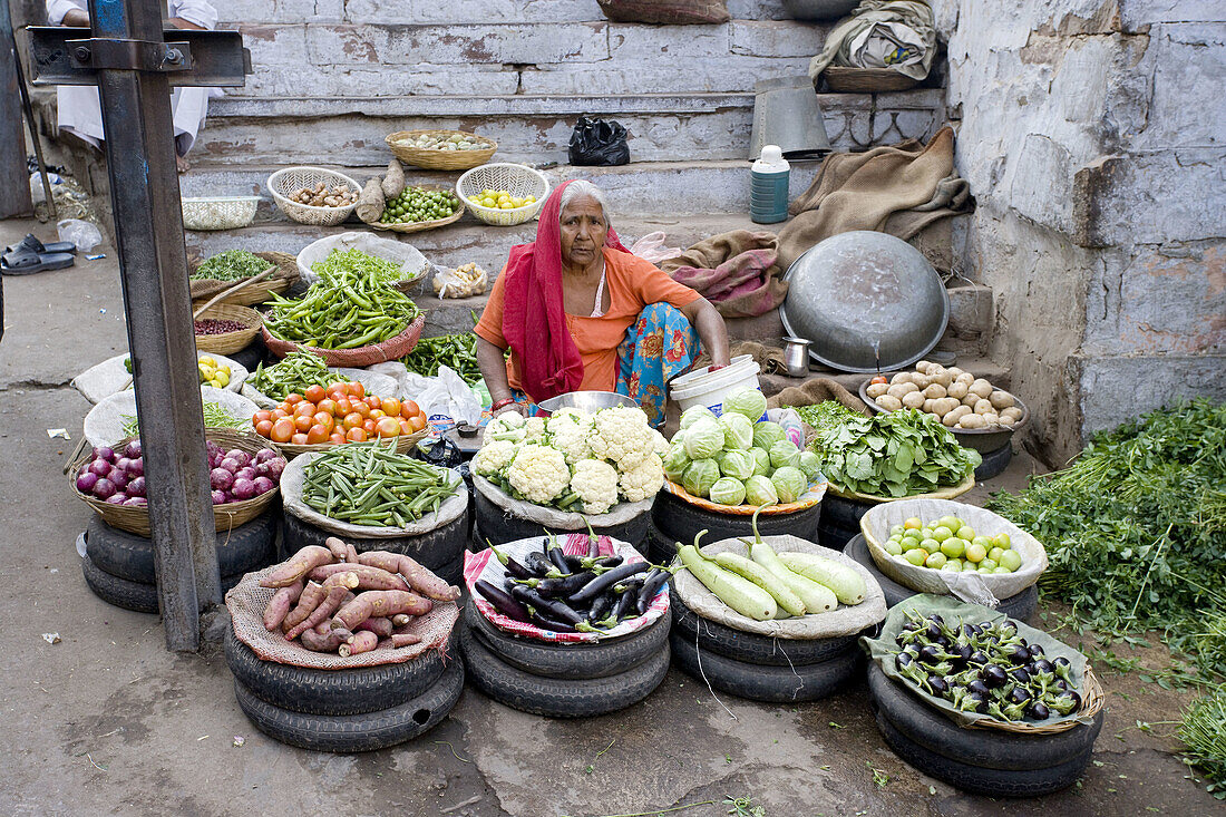 Vender seling vegetables in the street Market