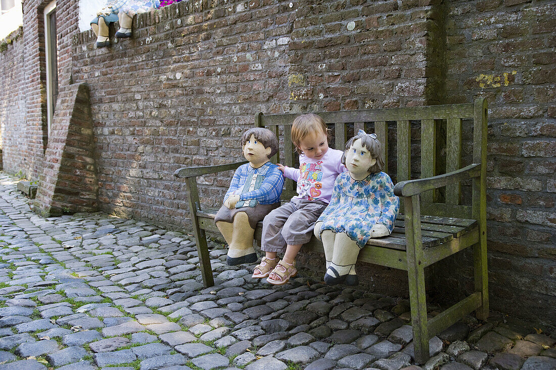 Girl and ceramic figurines,  Veere,  Zeeland,  Netherlands