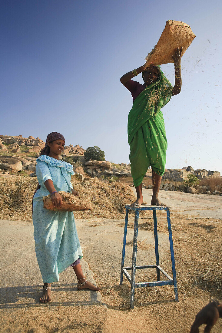 Women Sifting Rice,  Hampi,  Karnataka,  India