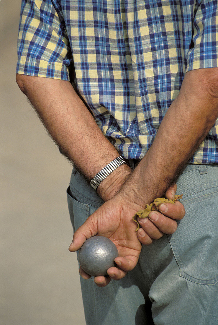 Man playing boules,  Gréoux-les-Bains. Alpes-de-Haute-Provence,  France