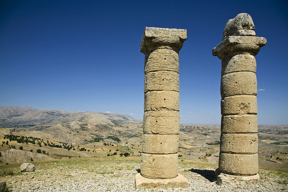 TURKEY,  Anatolia,  Nemrut Dagi National Park,  Karakus Tumulus,  Two columns one with lion on top near burial ground for Commagene Royal Family