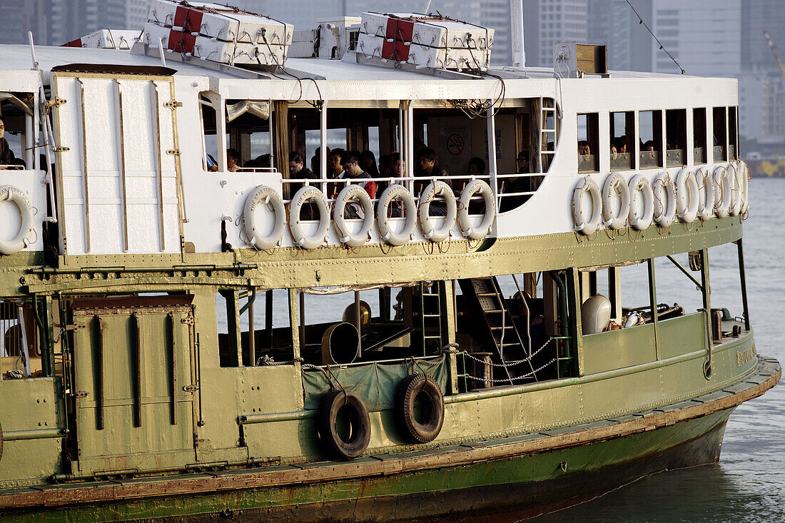 Close-up of a traditional harbor ferry crossing Hong Kong harbor bay from Hong Kong Island to Kowloon at a sunny afternoon,  Hong Kong,  China,  Southeast Asia