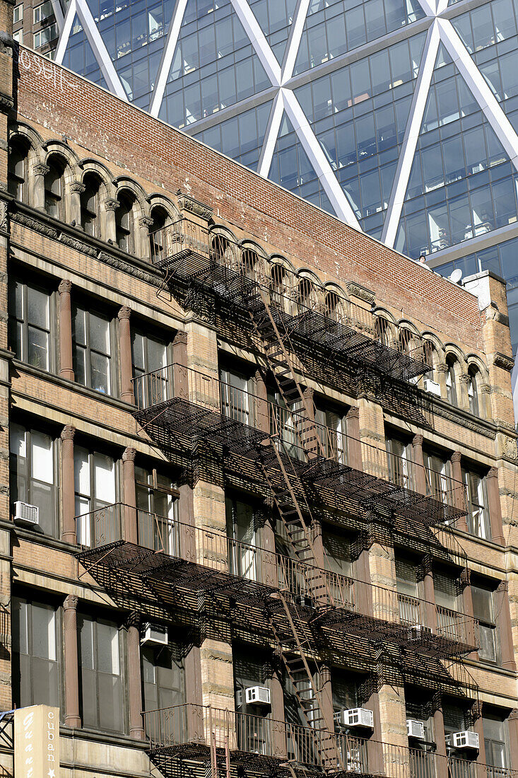 Pre-war office building with the characteristic fire-escape at the outside wall,  at Broadway,  Manhattan,  New York City,  United States,  North America