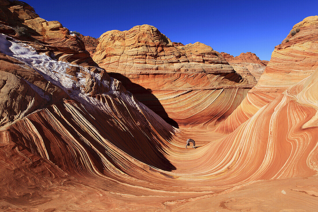 Coyote Buttes North,  The Wave,  woman acrobatic standing,  sandstone formed by wind and water,  Paria Wilderness Area,  Arizona,  USA