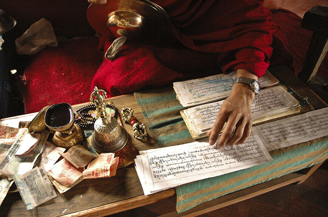 The hands of a monk chanting religious text Tiksey,  Ladakh,  India