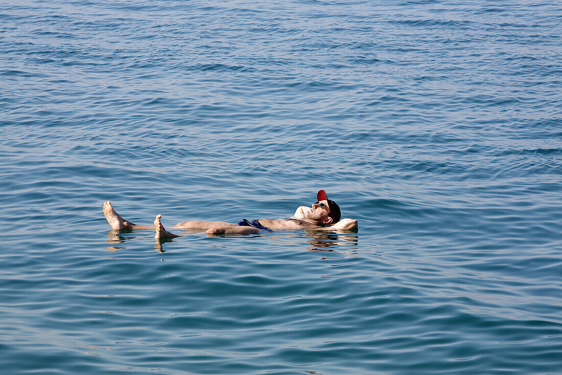 Jordan,  Dead Sea Man floating at the Dead Sea