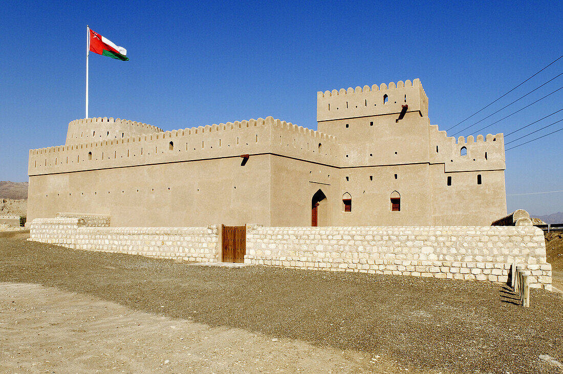 historic adobe fortification Mahadah fort or castle near Buraimi,  Hajar al Gharbi Mountains,  Al Dhahirah Region,  Sultanate of Oman,  Arabia,  Middle East