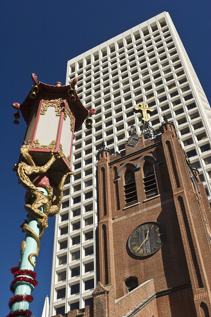 Lamp post,  Old St Marys steeple and an office tower in San Francisco´s Chinatown