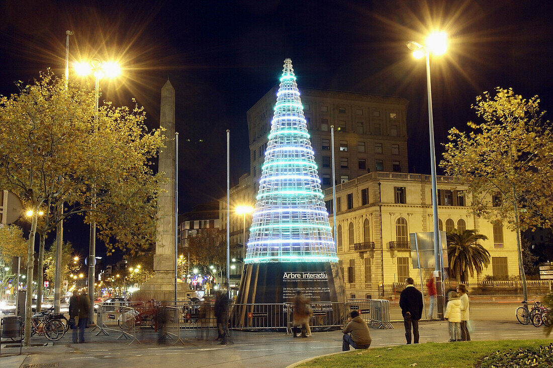 Low consumption Christmas tree in the corner between Avinguda Diagonal and Passeig de Gracia,  Barcelona,  Catalonia,  Spain