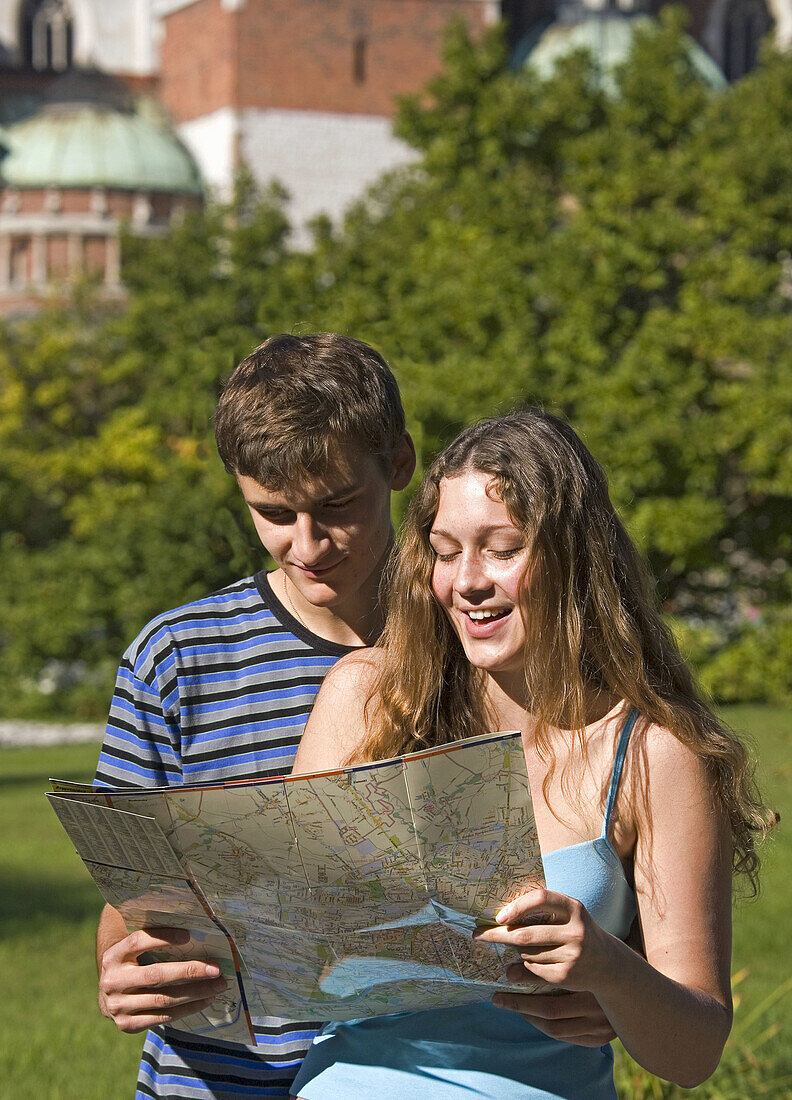 Poland Krakow,  Couple with city map by Wawel Castle