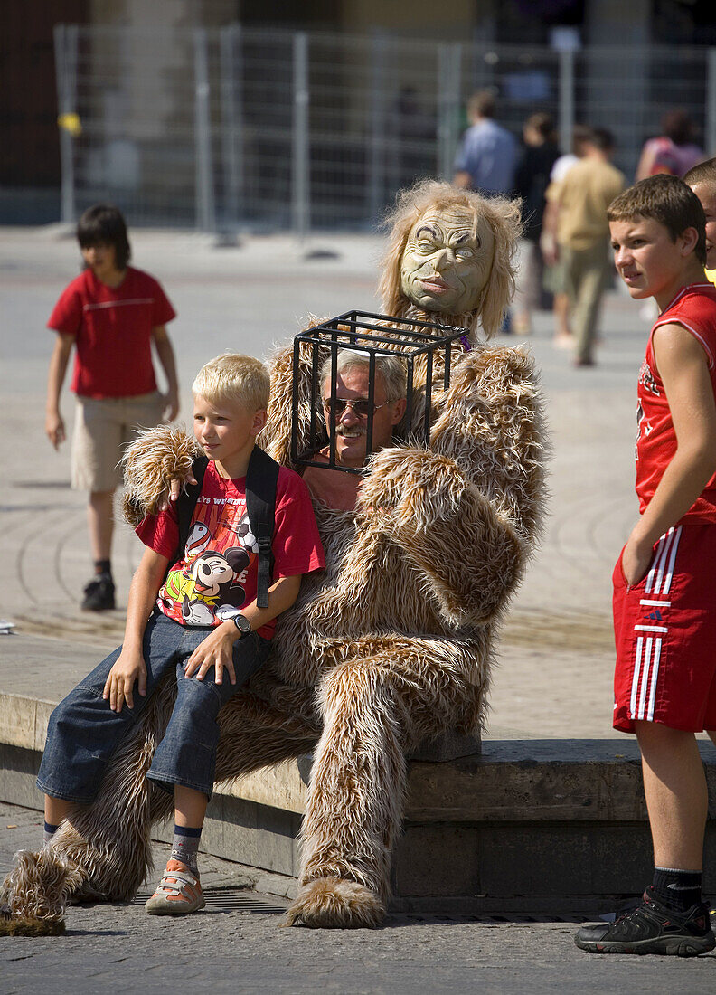 Street performer,  Big Foot at Main Market Square,  Krakow,  Poland