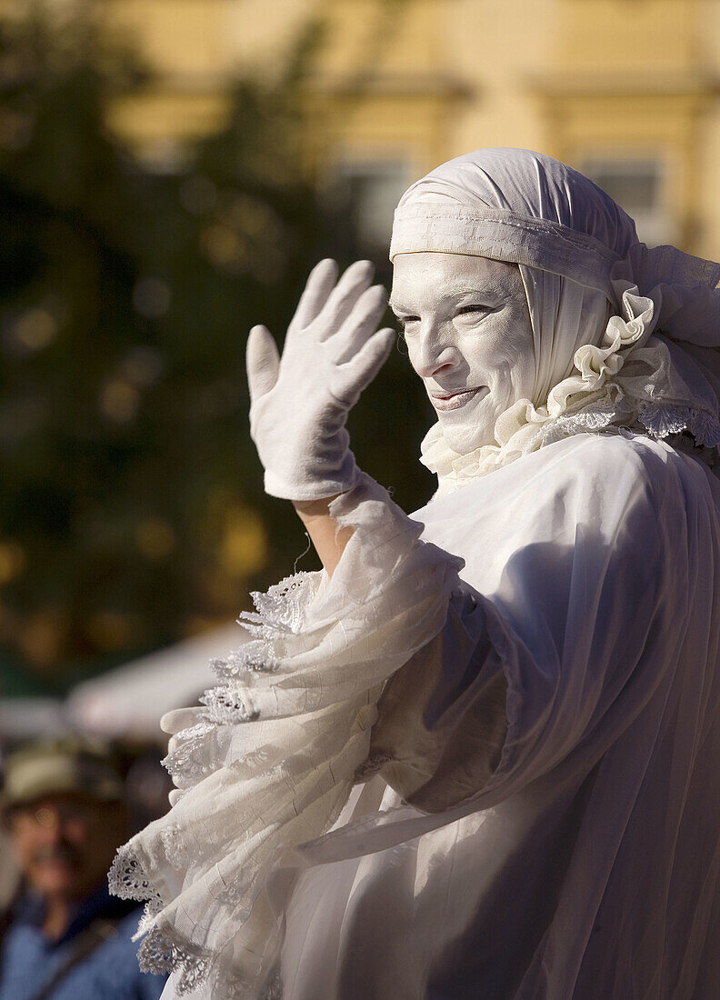 White Lady,  woman street performer at Main Market Square,  Krakow,  Poland
