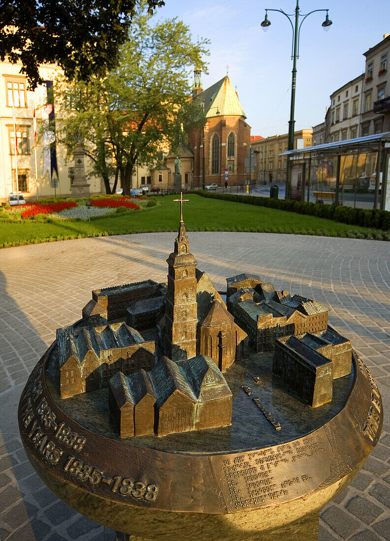 Poland,  Krakow,  model of former church Wszystkich Swietych in background basilica of St Francis’ Franciszkanow