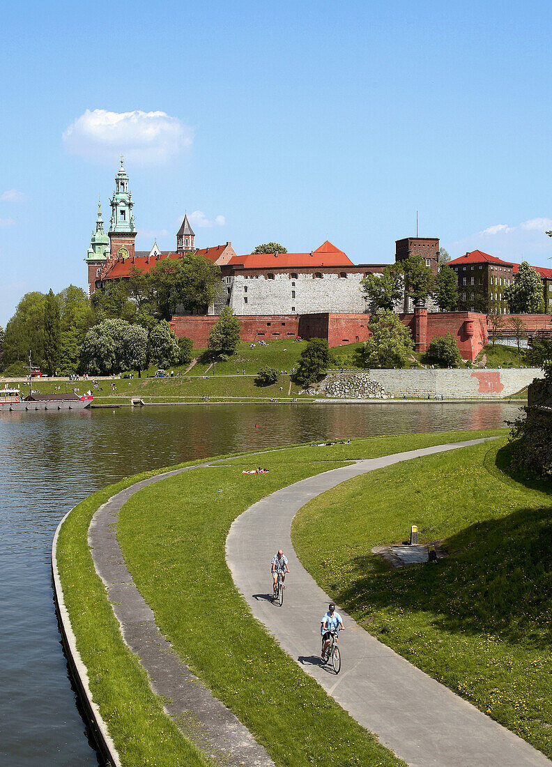 Poland,  Krakow,  people resting by Vistula river,  Wawel Hill