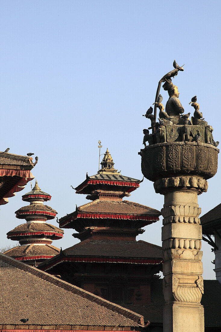 Nepal,  Kathmandu,  Durbar Square,  spires of Hanuman Dhoka Palace,  King Malla Column