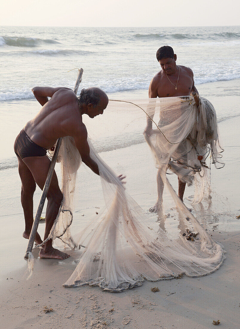India,  Goa,  Colva beach,  fishermen with fishing net