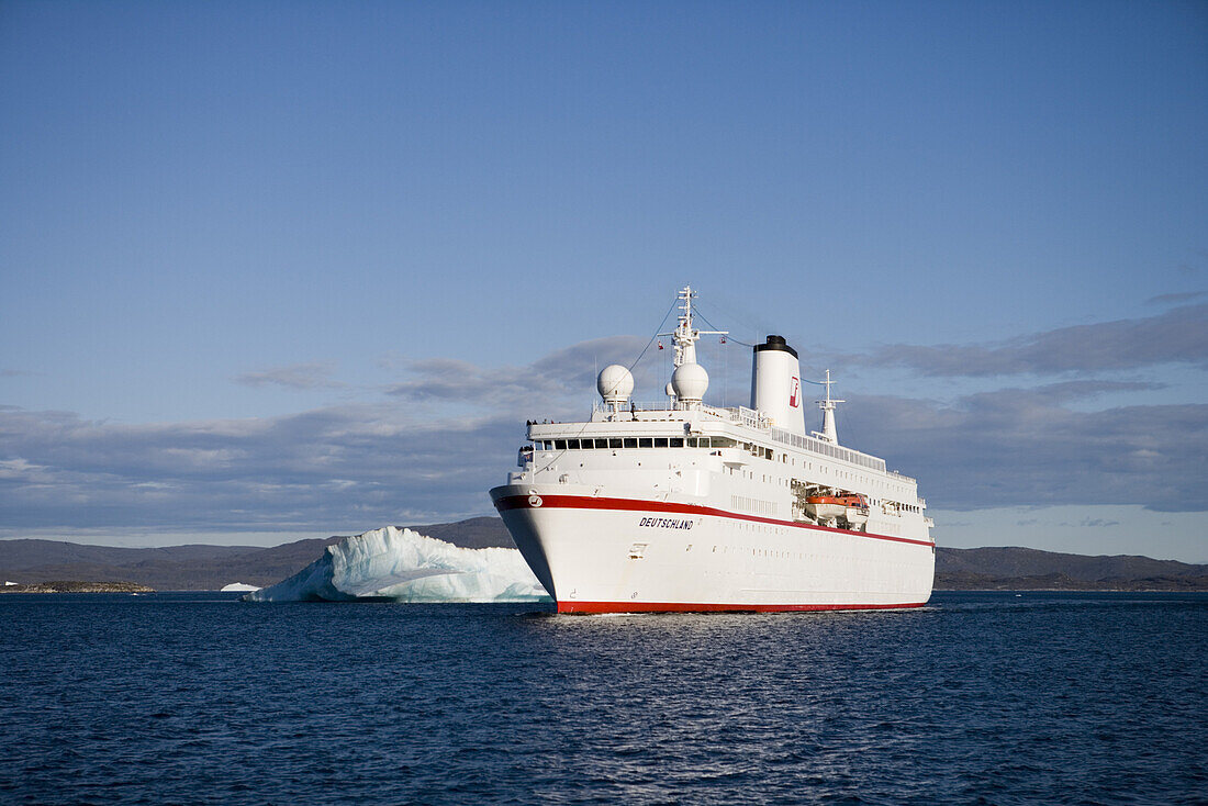 Cruise ship MS Deutschland and icebergs in the sunlight, Kitaa, Greenland