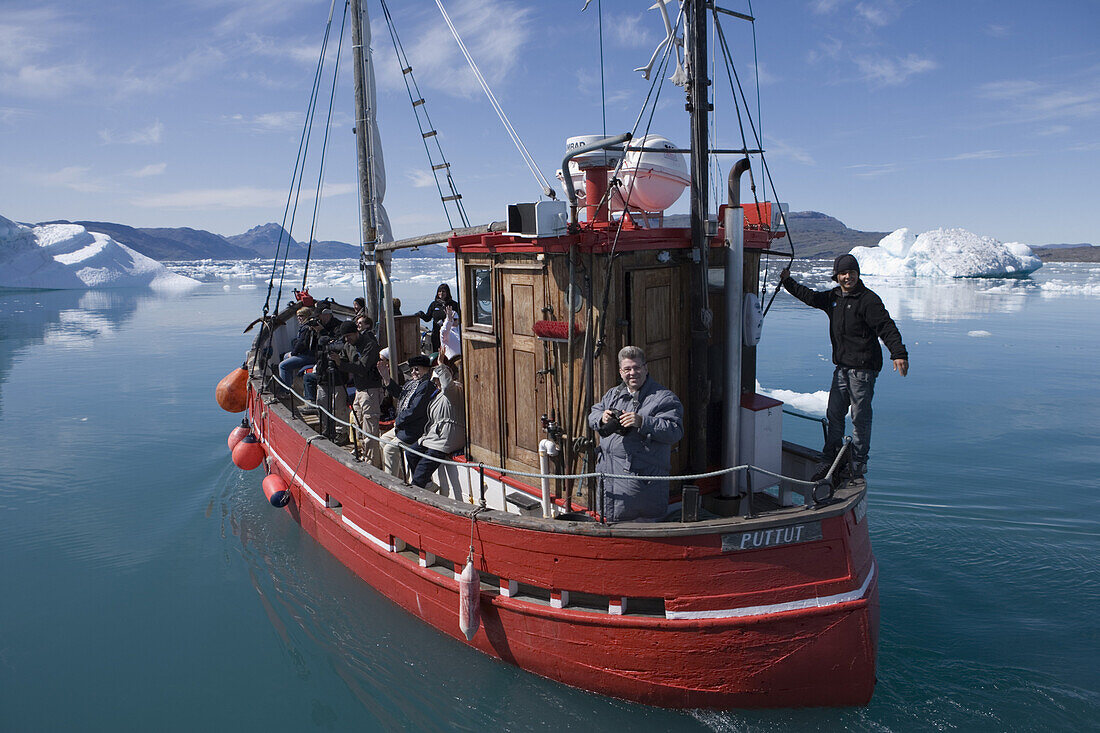 Fishing boat on sightseeing tour in front of icebergs at Qooroq Fjord, Narsarsuaq, Kitaa, Greenland