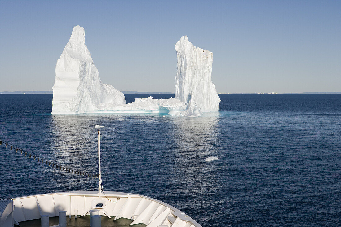 Cruise ship MS Deutschland approaching iceberg from Ilulissat Kangerlua Icefjord, Ilulissat (Jakobshavn), Disko Bay, Kitaa, Greenland