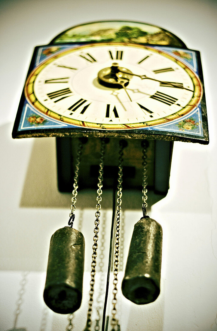 Old wall clock with roman numbers