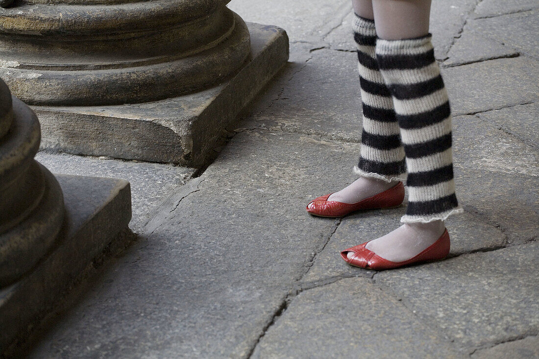 Girl´s legs with red shoes