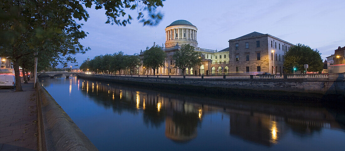Ireland,  Dublin,  James Gandon´s Four Courts reflects in the River Liffey at dawn