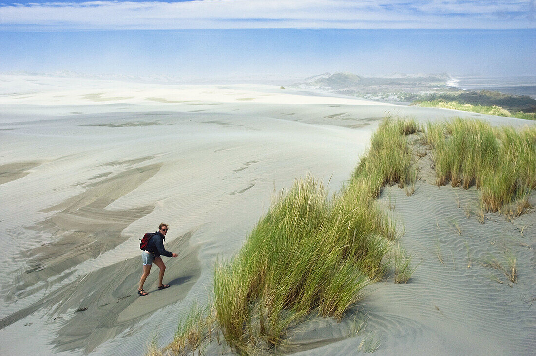 Walking on sand dunes Farewell Spit,  New Zealand