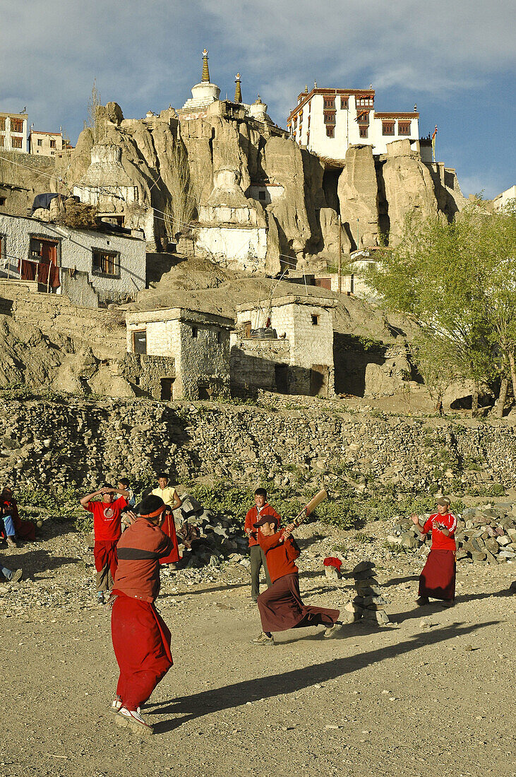 Novice monks playing cricket below the monastery Lama Yuru,  Ladakh,  India