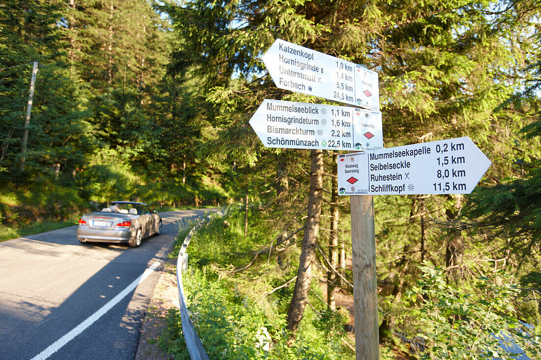 Convertible passing road near Lake Mummelsee, Seebach, Black Forest, Baden-Wuerttemberg, Germany