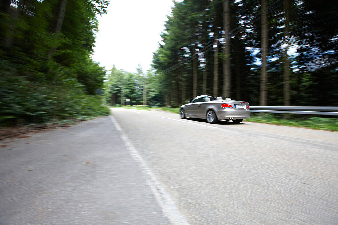 Convertible on a road, Black Forest, Baden-Wuerttemberg, Germany