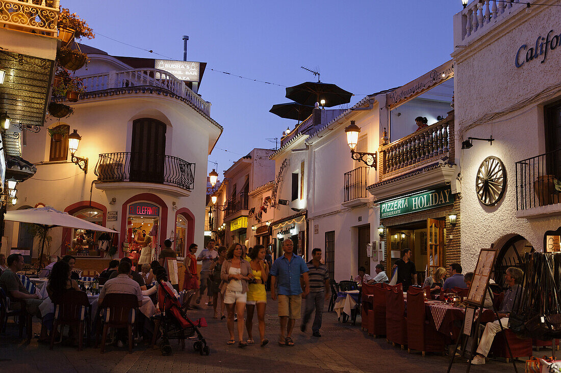 Guests in restaurants in Old Town in the evening, Nerja, Andalusia, Spain