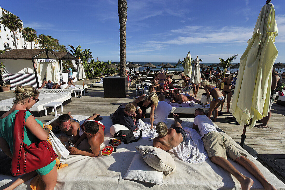 Vacationers in Buddha Beach Club, Puerto Banus, Marbella, Andalusia, Spain