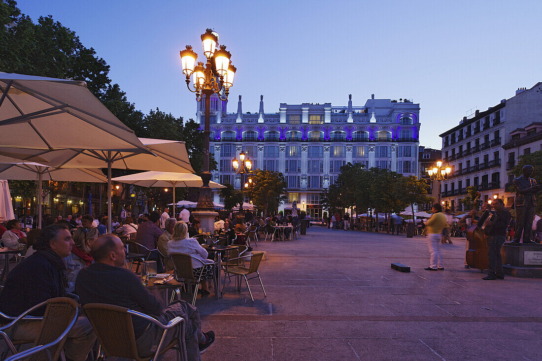 Pavement cafes Placa Sant Ana in the evening, Hotel Me Madrid Reina Victoria in background, Calle de Huertas, Madrid, Spain