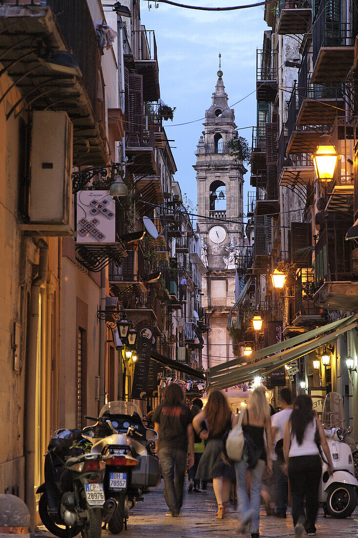 View along a street to spire near Piazza Olivella, Palermo, Sicily, Italy