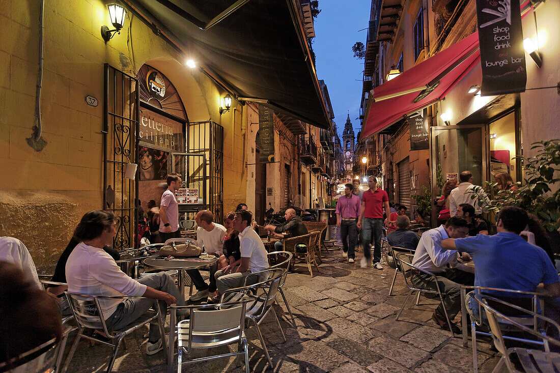 Guests in a pavement cafe near Piazza Olivella, Palermo, Sicily, Italy